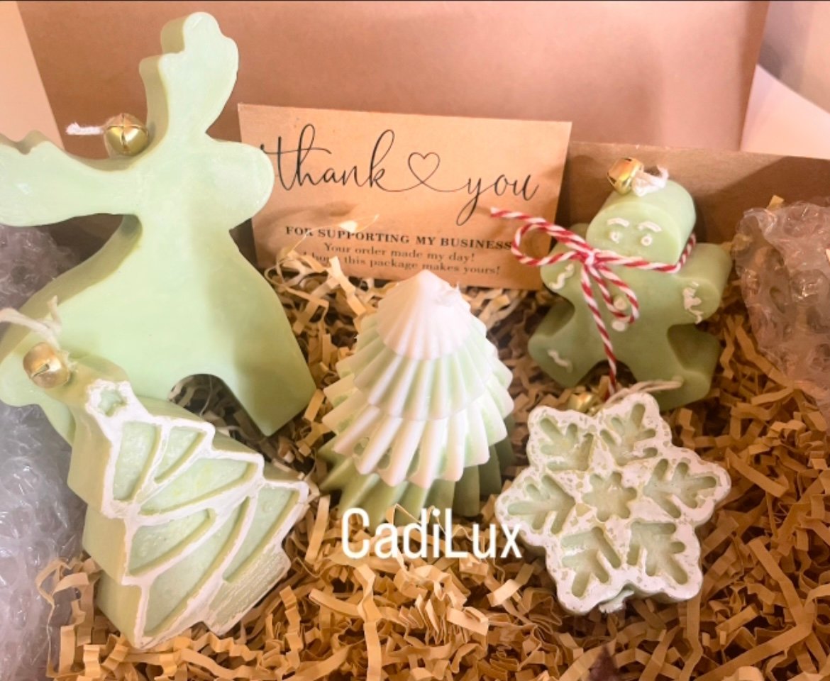 a luxurious four candle ensemble presented in a signature gift box a luxurious four candle ensemble presented in a signature gift box